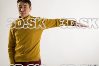 Arm flexing reference of yellow sweater red trousers Sidney 0003